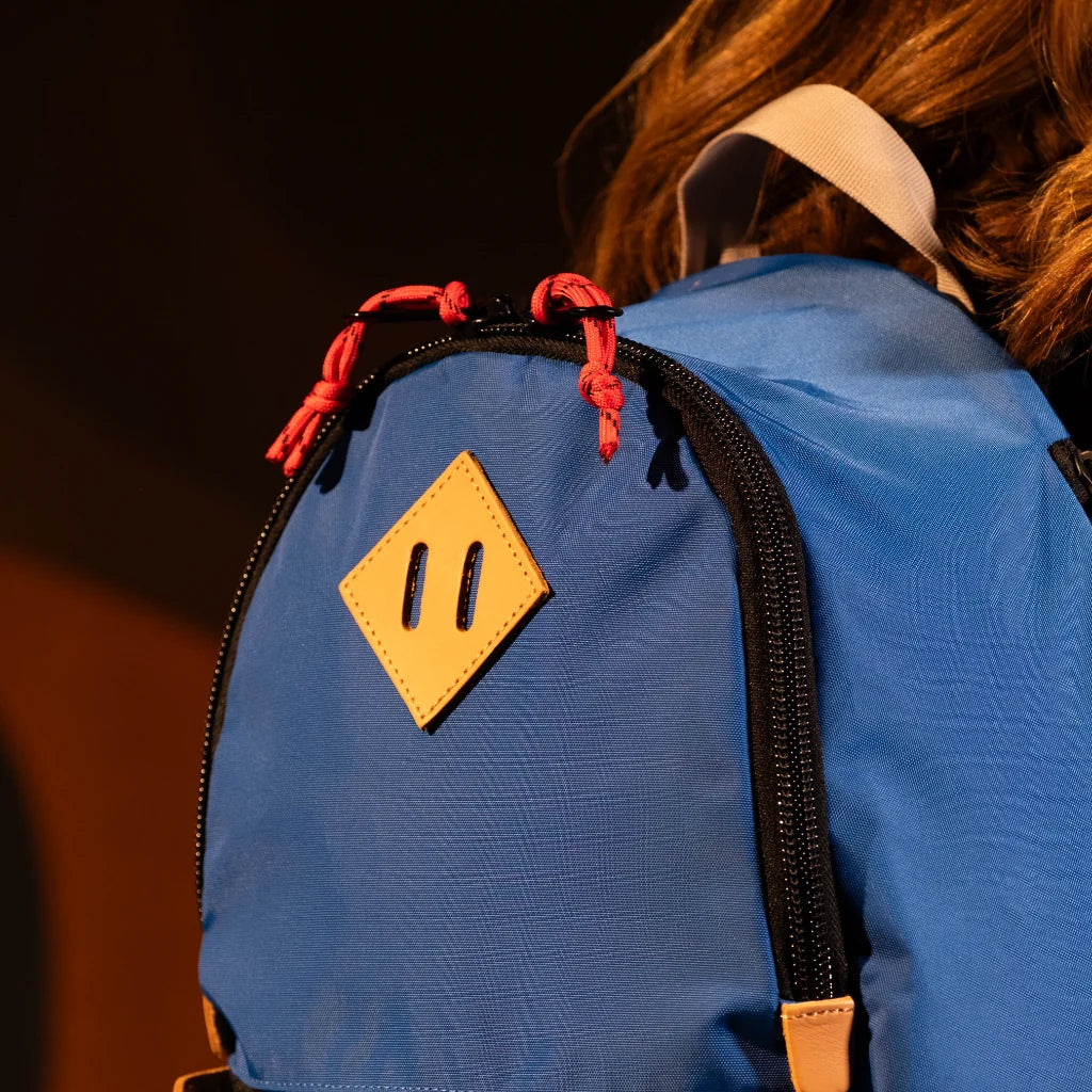 General model view detail image of the Topo Designs Classic Teardrop Backpack in "Classic Blue".