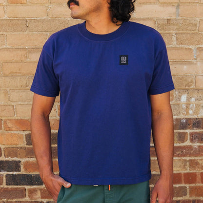 Front lifestyle image of Topo Designs x Soft Goods Label Tee in "Jelly"