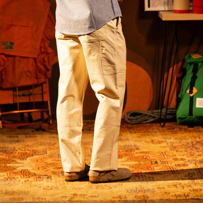 General model shot of Topo Designs Utility Pants Undyed - Men's in "Undyed"