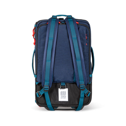 Shot of backpack straps on Topo Designs Global Travel Bag Roller durable carry-on convertible laptop rolling suitcase in Navy blue.