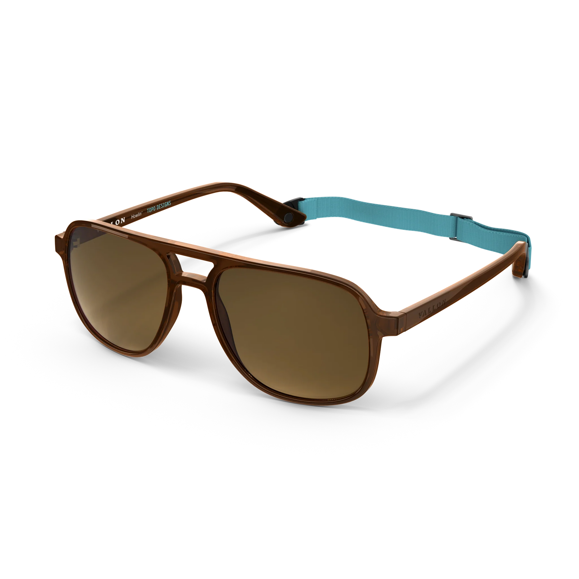 General angled view of VALLON X Topo Designs sunglasses in "Brown / Brown" with sunglass arms open and strap attached.
