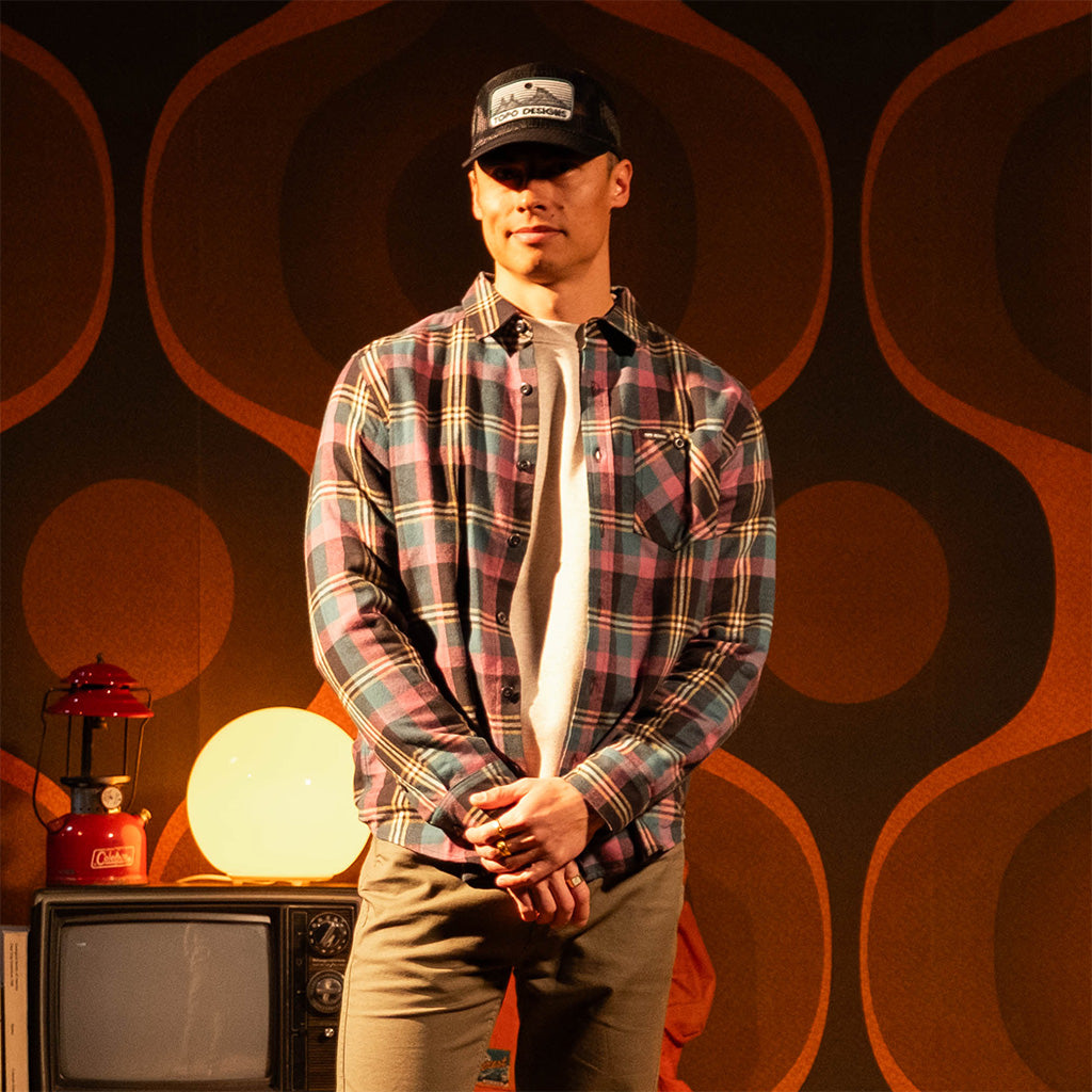 General shot of Person wearing a "Black / Goldenrod Multi" Mountain Shirt Lightweight with a dark background