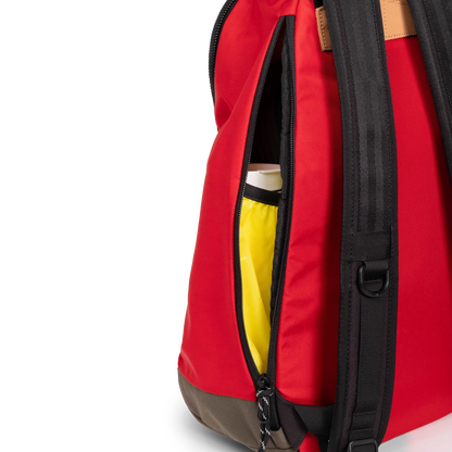General detail view of Topo Designs Classic Teardrop Backpack in "Salsa" with the side zippered access opened.