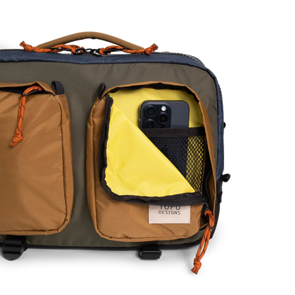 General full front product shot of the global briefcase showing use of the front zip pocket in "Olive / Dark Khaki".