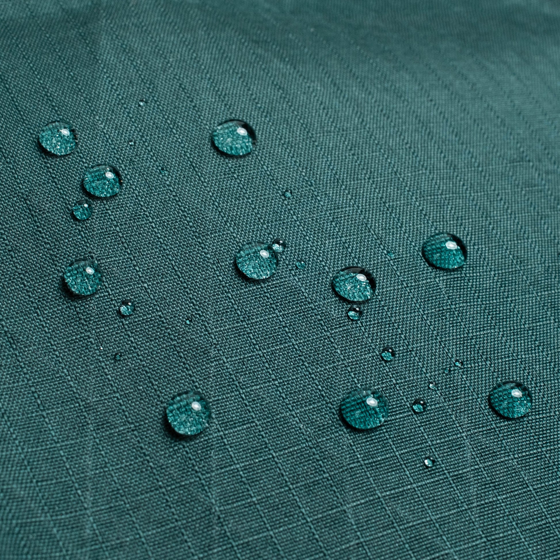 General shot of Topo Designs Global Pro Travel Tote showing water droplets on waterproof fabric