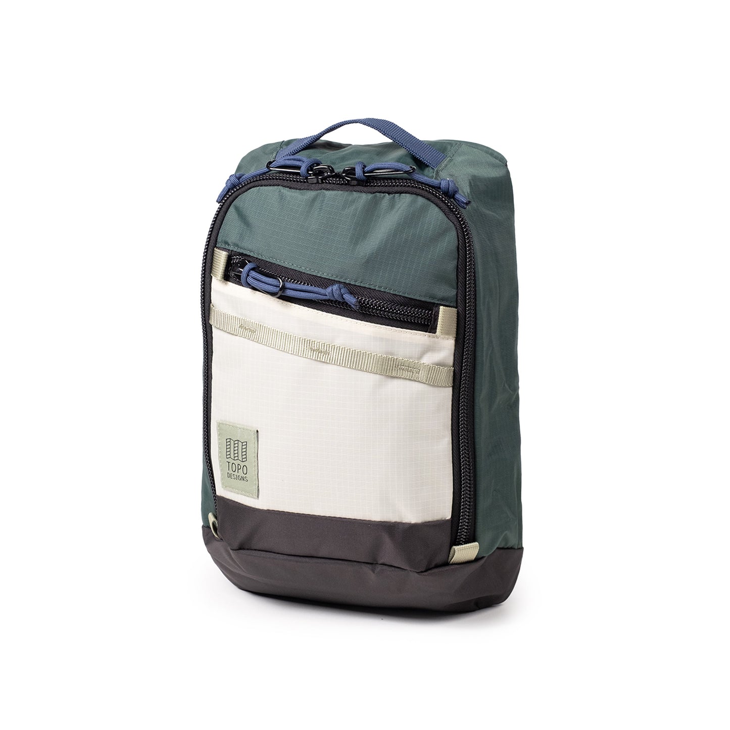 Quarter View of Topo Designs Mountain Sling Bag in "Forest / Bone White"