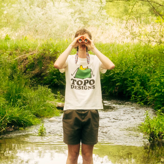 General lifestyle image of Topo Designs x TSPTR Tent Tee in "White"