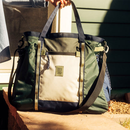 General lifestyle image of Mountain Gear Bag in "Forest / Bone White"
